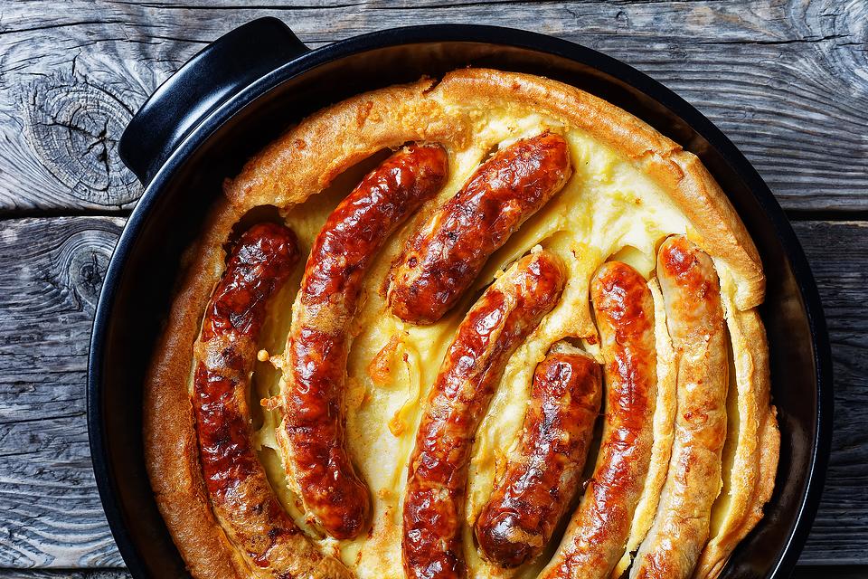 Toad in a Hole Recipe With Buttery Yorkshire Pudding & Herbed Shallot Gravy Is Destined for Greatness